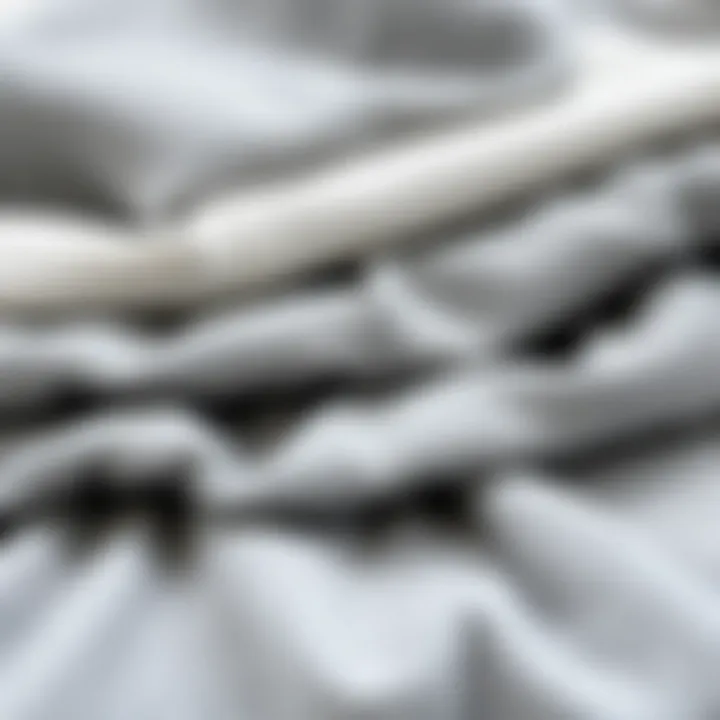 Different textures of grey fabrics used in coverlets