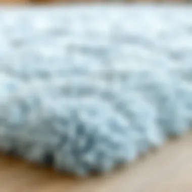 Close-up of Plush Light Blue Rug Close-up of a plush light blue rug showcasing texture and comfort