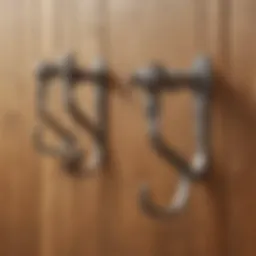 A collection of intricate vintage curtain hooks showcased on a wooden surface.