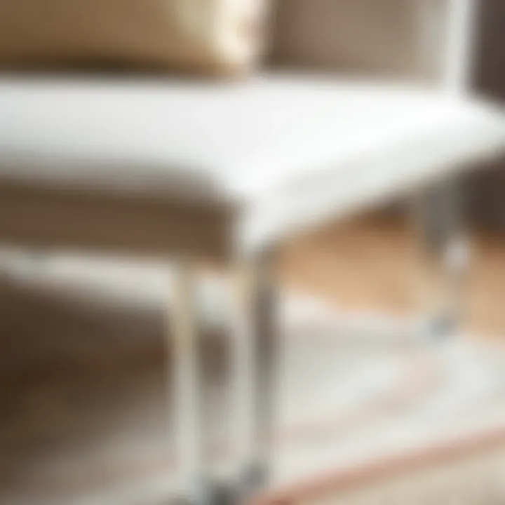 Close-up of the construction details of an accent chair showcasing clear legs.