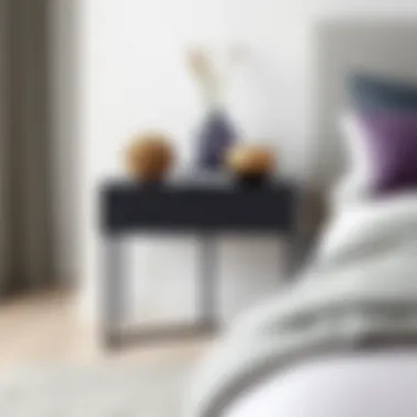 Minimalist black side table showcasing decorative pieces