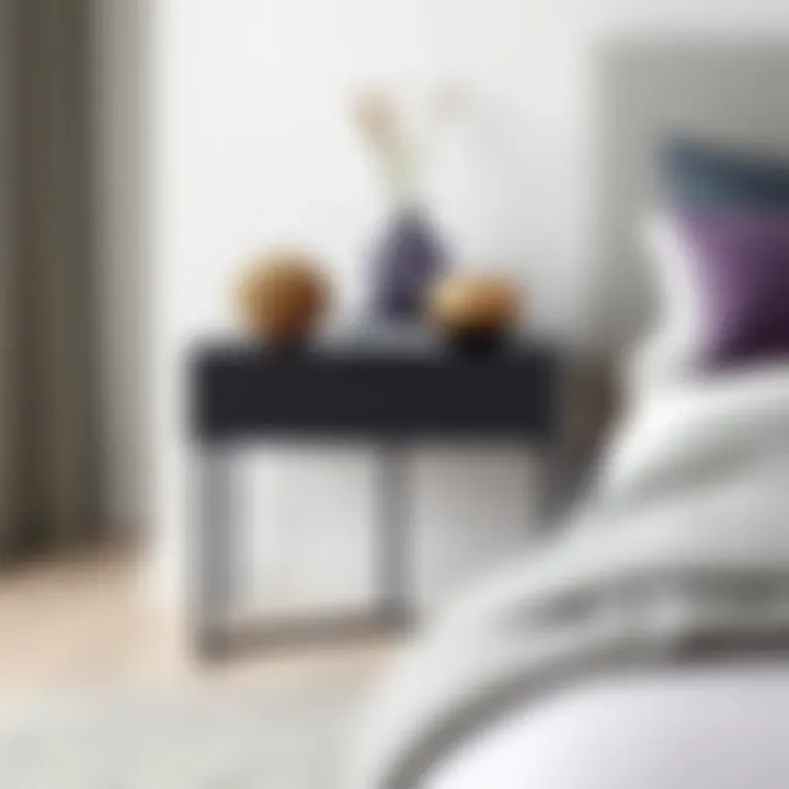 Minimalist black side table showcasing decorative pieces